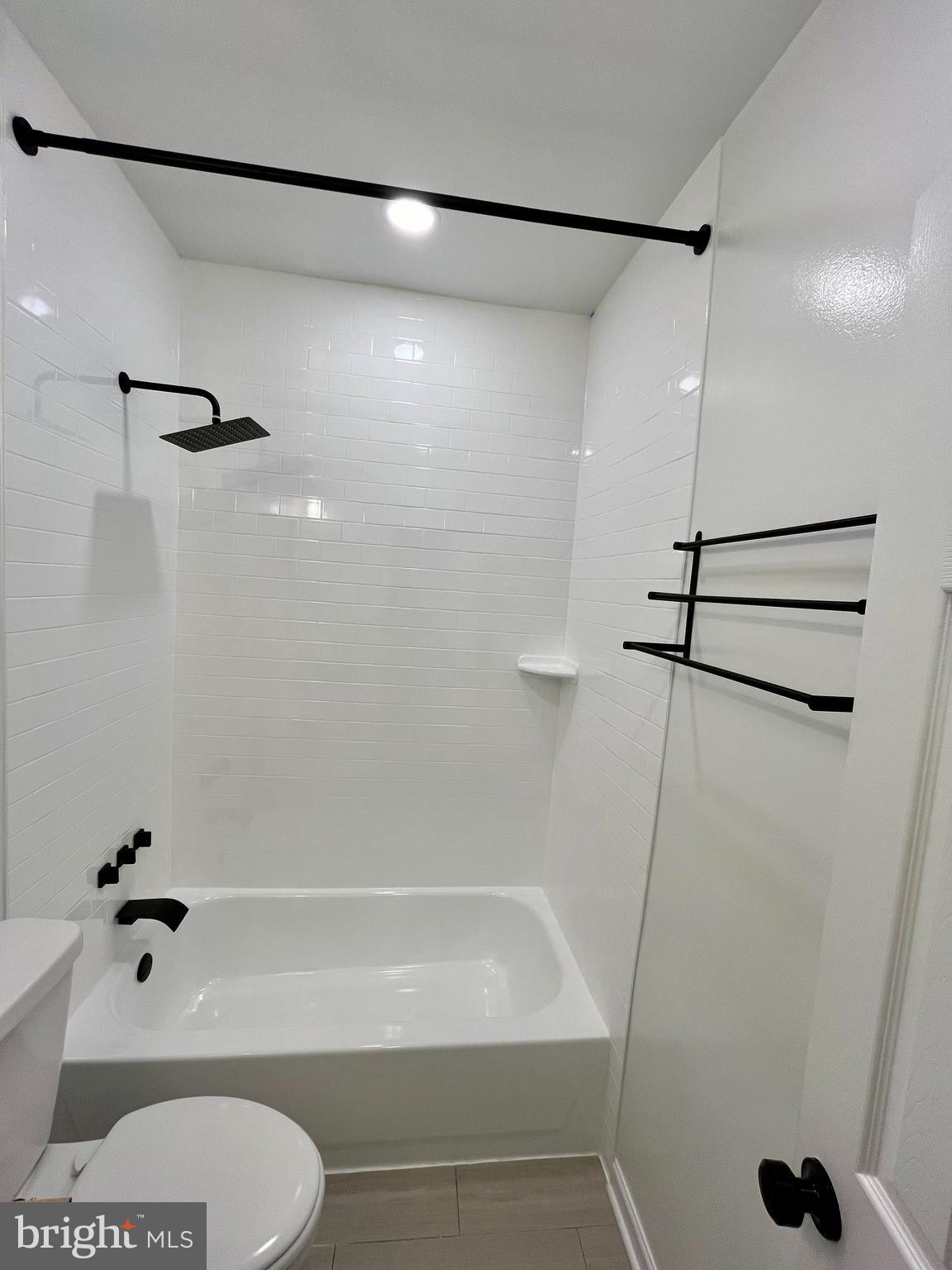 1718 West Virginia Avenue Northeast, Unit 1 Washington, DC 20002 - Photo 8 of 12 a bathroom with a shower a toilet and a shower