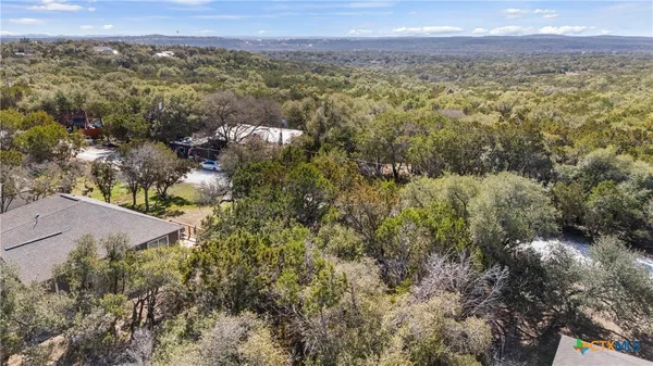an aerial view of residential house with outdoor space