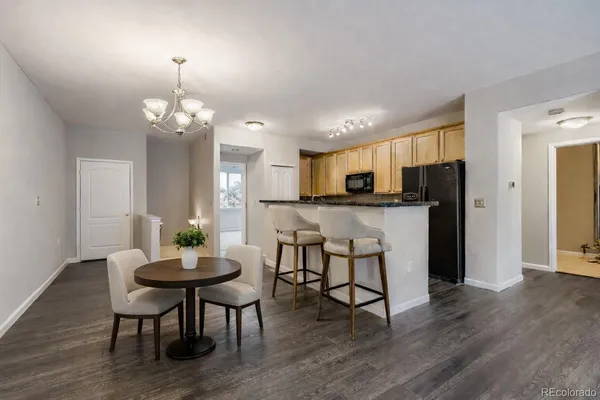 a view of a dining room with furniture and wooden floor