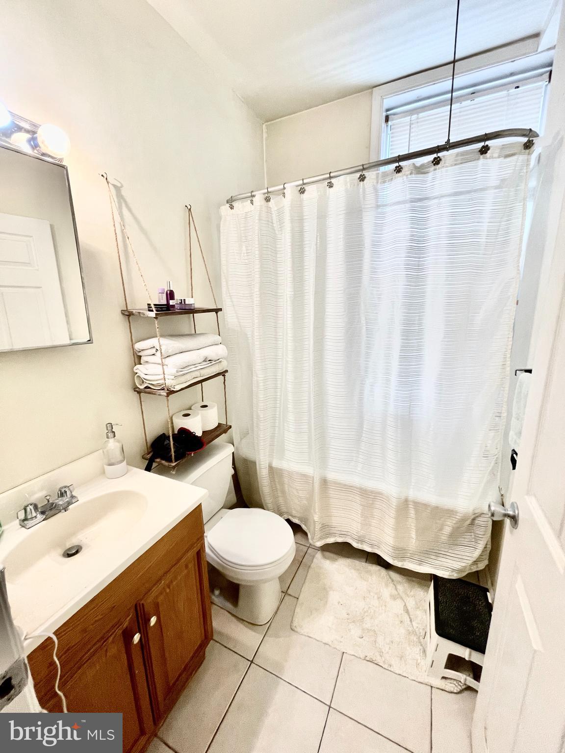 4217 Ridge Avenue, Unit 2 Philadelphia, PA 19129 - Photo 3 of 11 a bathroom with a sink toilet and shower