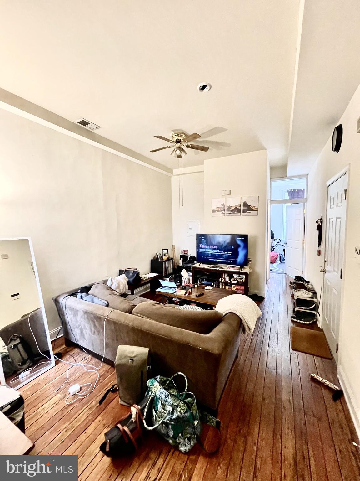 4217 Ridge Avenue, Unit 2 Philadelphia, PA 19129 - Photo 7 of 11 a living room with furniture and a flat screen tv