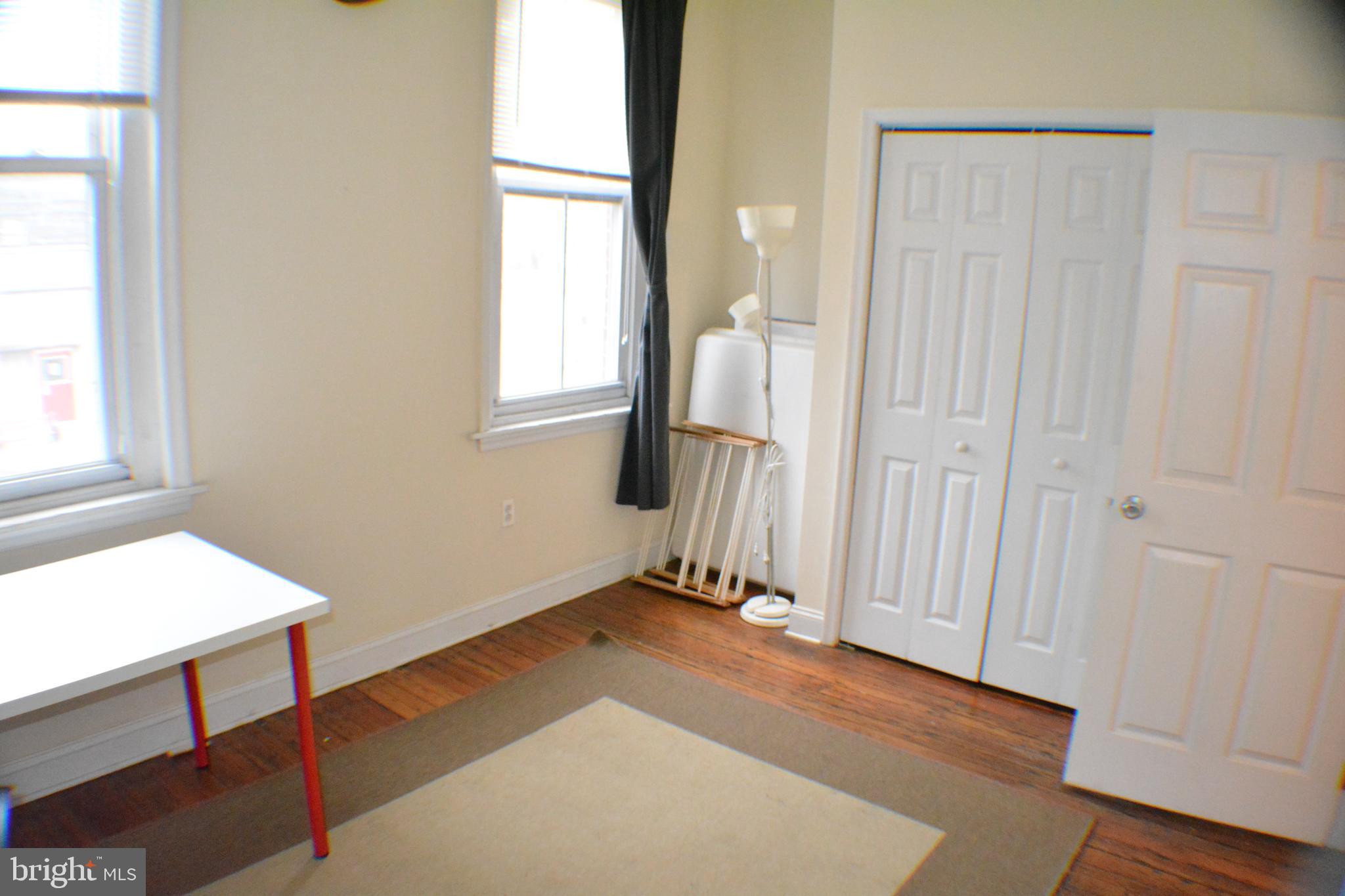 4217 Ridge Avenue, Unit 2 Philadelphia, PA 19129 - Photo 9 of 11 a view of a room with wooden floor and a window