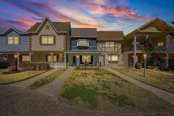 a front view of a residential apartment building with a yard