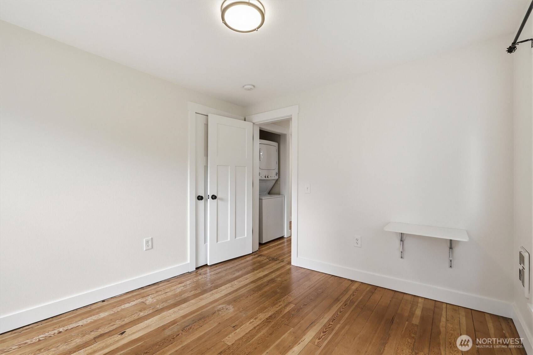 1651 Southwest 114th Street Seattle, WA 98146 - Photo 20 of 37 a view of an empty room and wooden floor