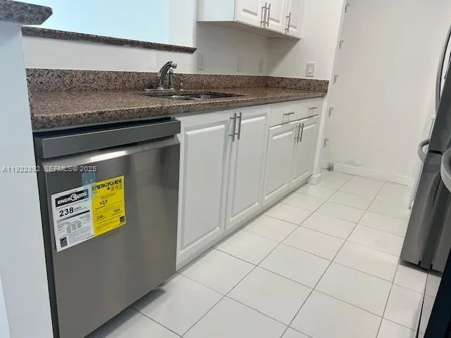 a kitchen with a sink and a stove