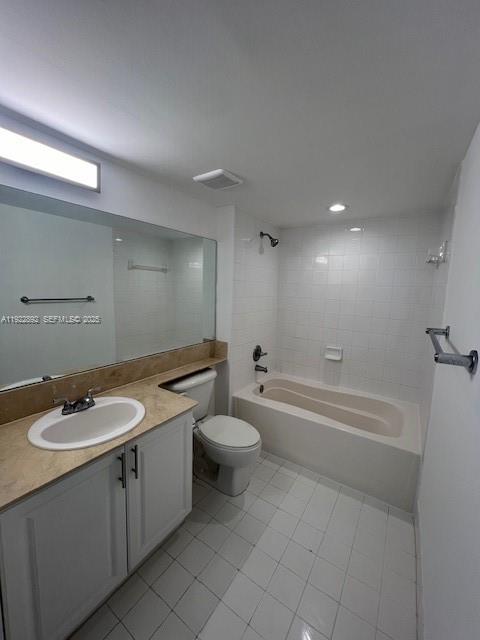 1155 Brickell Bay Drive, Unit 3205 Miami, FL 33131 - Photo 5 of 14 a bathroom with a granite countertop sink a toilet a mirror and bathtub