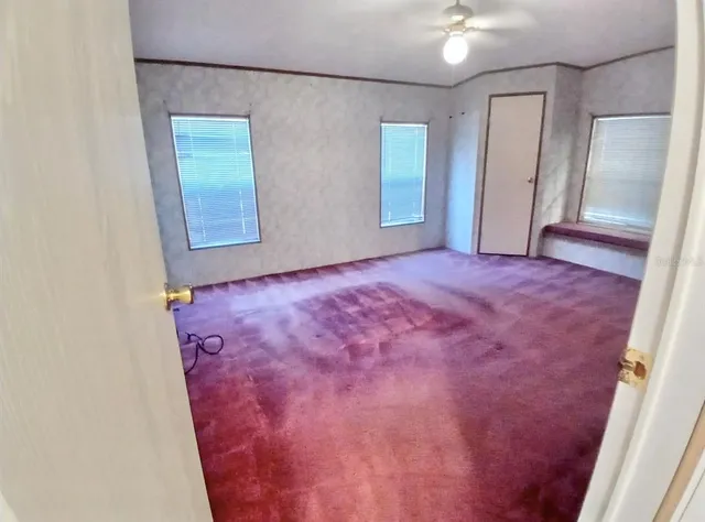 a kitchen with stainless steel appliances granite countertop a stove top oven a sink and a refrigerator