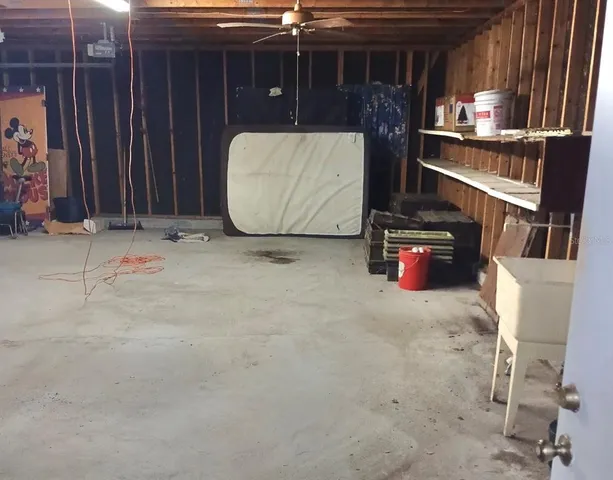 a view of backyard with large trees and a barn