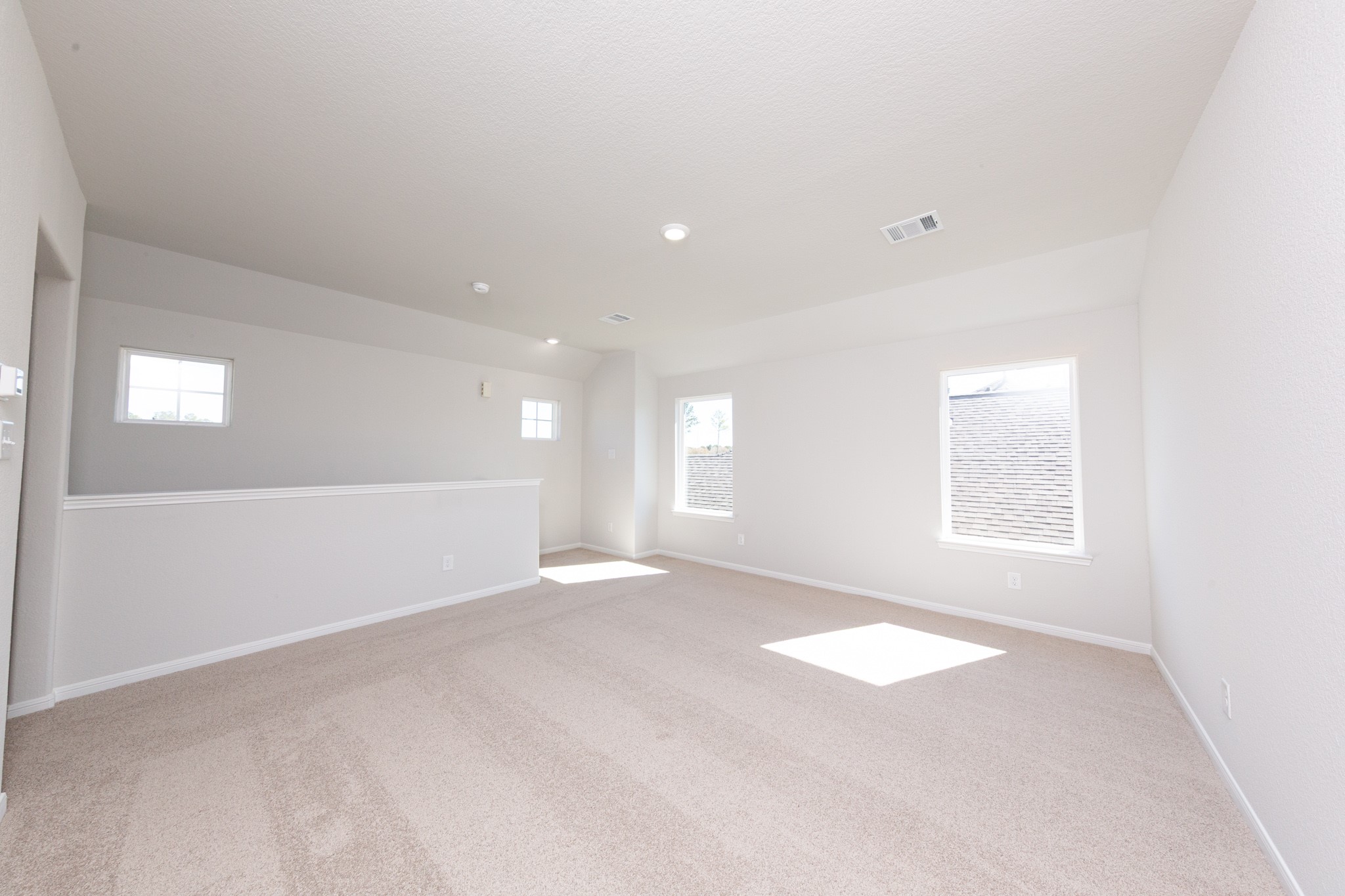 15627 Tranquil Pines Street Conroe, TX 77302 - Photo 15 of 27 a view of an empty room with a window