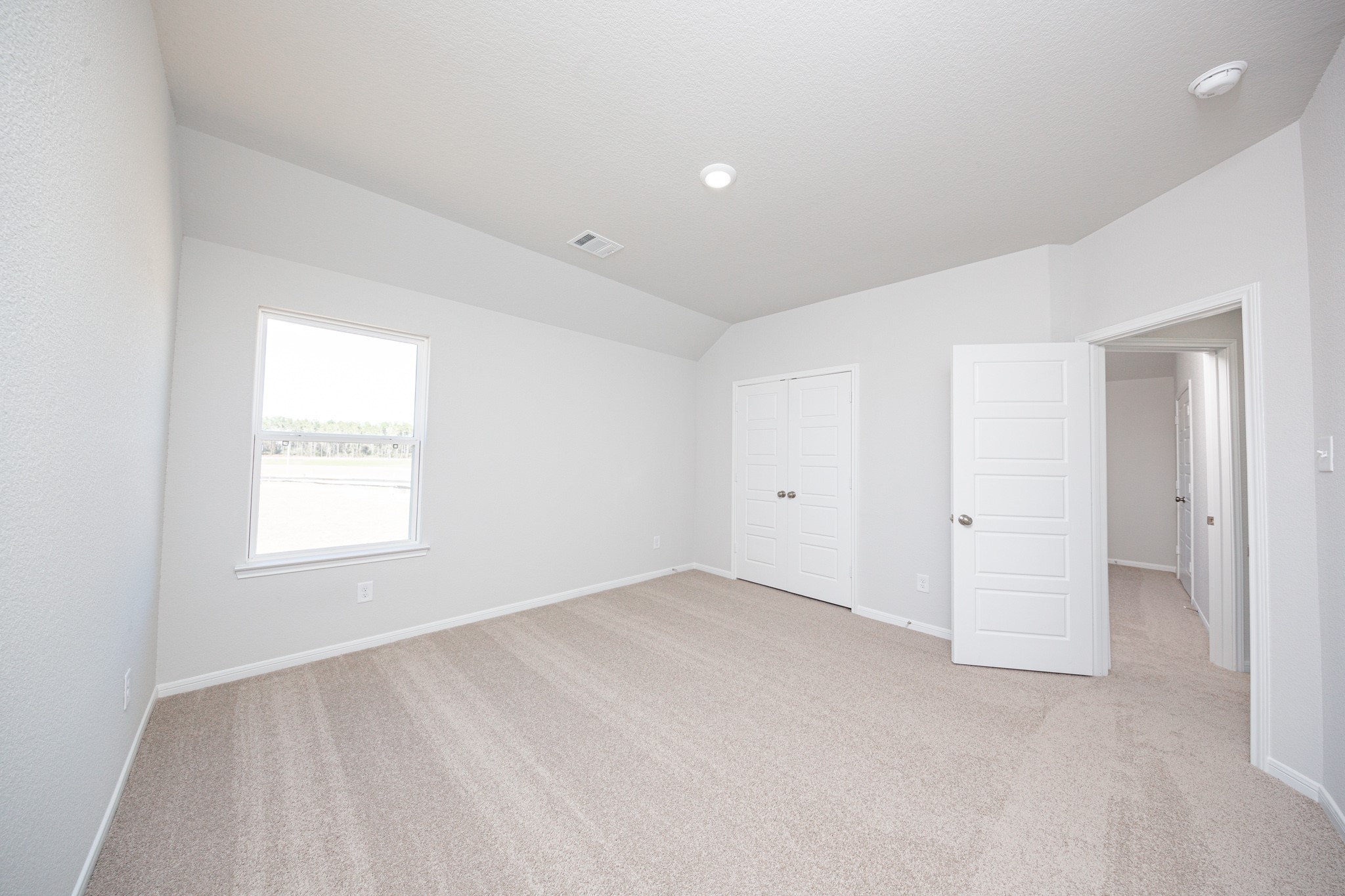 15627 Tranquil Pines Street Conroe, TX 77302 - Photo 18 of 27 an empty room with a window