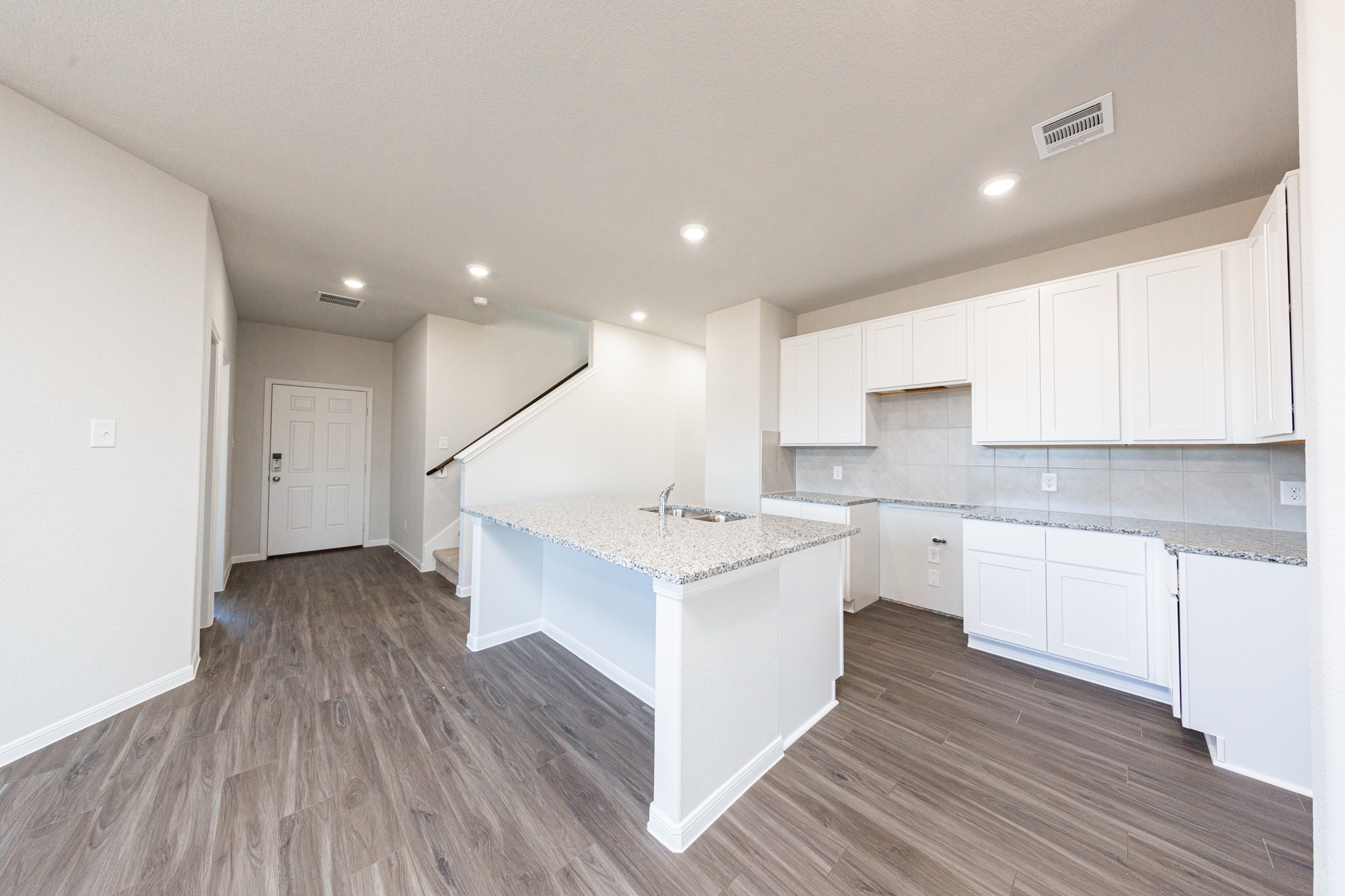 15627 Tranquil Pines Street Conroe, TX 77302 - Photo 2 of 27 a kitchen with a sink and cabinets