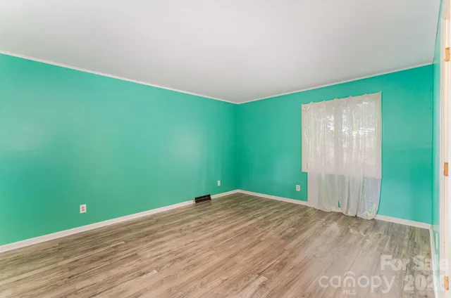 a view of a big room with wooden floor