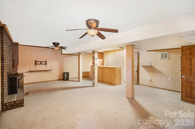 a view of a livingroom with a furniture and a ceiling fan
