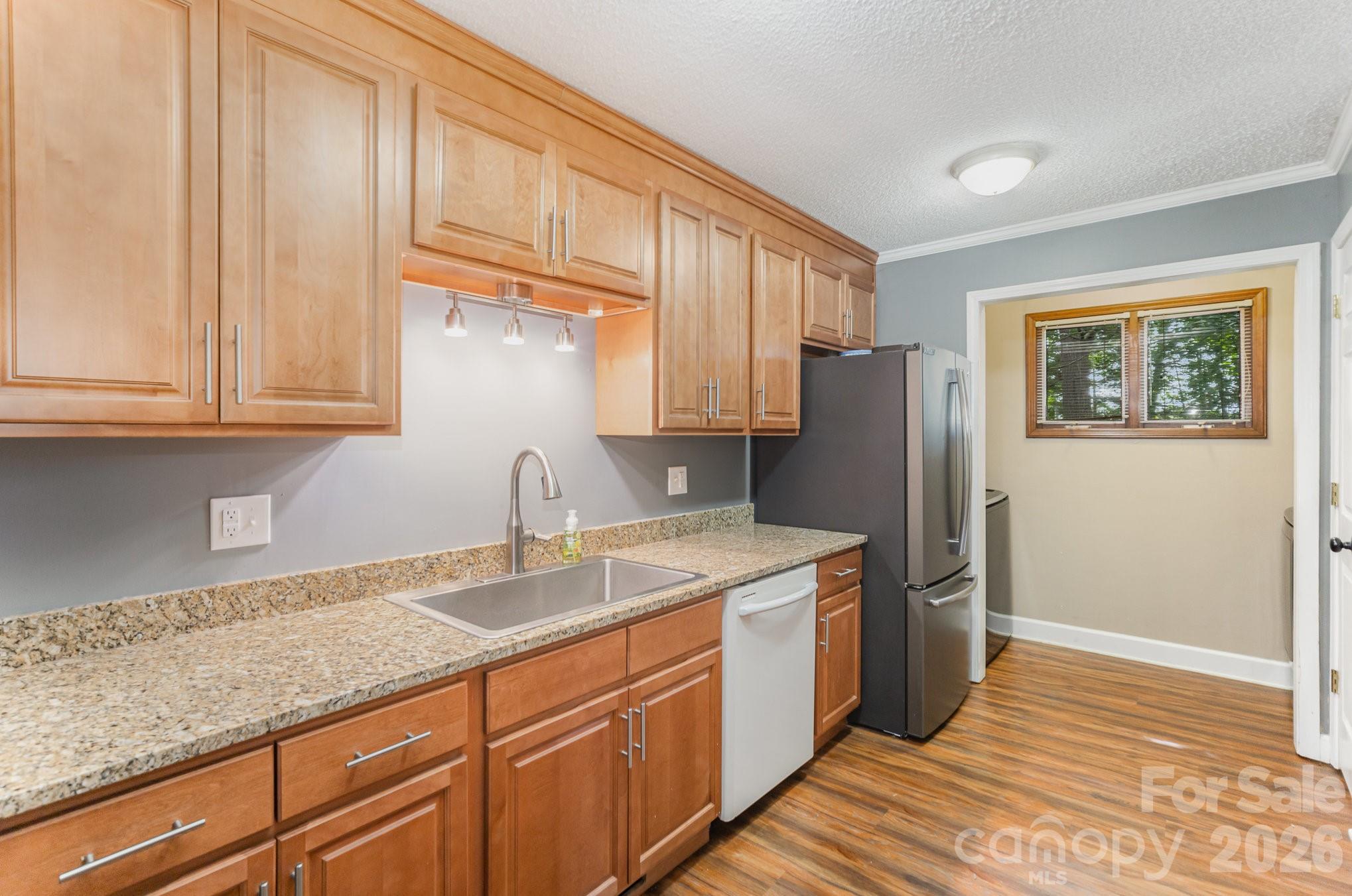 110 Hidden Valley Cherryville, NC 28021 - Photo 6 of 23 a kitchen with stainless steel appliances granite countertop a refrigerator sink and cabinets