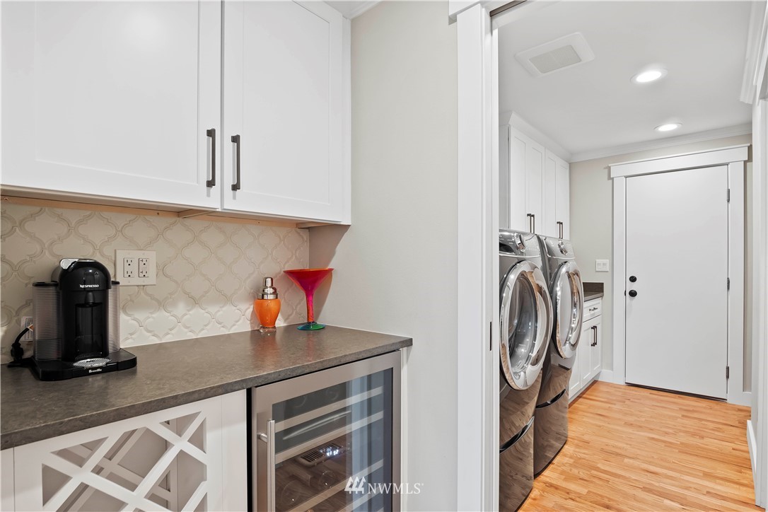 10404 Northeast 197th Street Bothell, WA 98011 - Photo 14 of 29 a kitchen with a refrigerator and a stove top oven