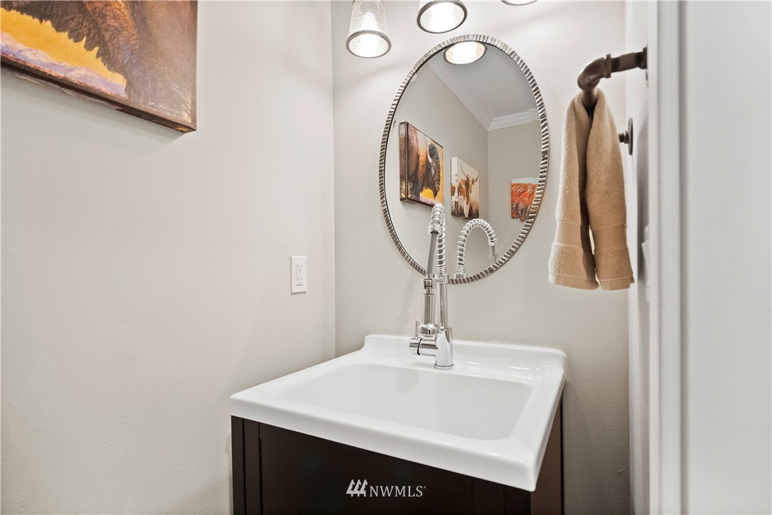 10404 Northeast 197th Street Bothell, WA 98011 - Photo 15 of 29 a bathroom with a sink and a mirror