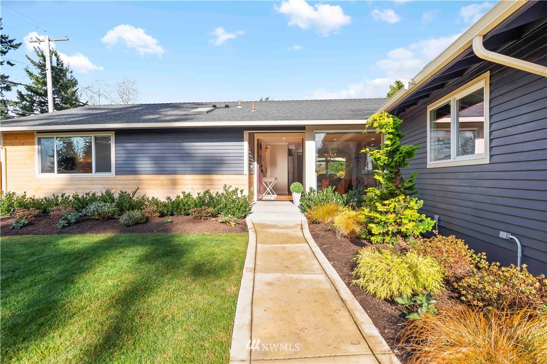 10404 Northeast 197th Street Bothell, WA 98011 - Photo 3 of 29 a front view of a house with a yard and potted plants