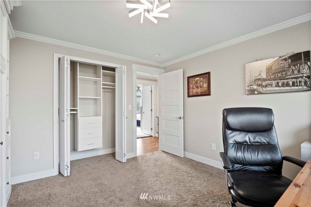 10404 Northeast 197th Street Bothell, WA 98011 - Photo 21 of 29 a room with furniture and chandelier