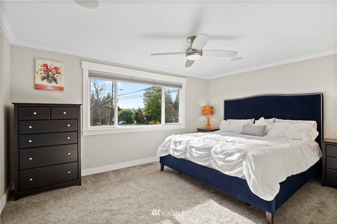 10404 Northeast 197th Street Bothell, WA 98011 - Photo 22 of 29 a bedroom with a bed and a window