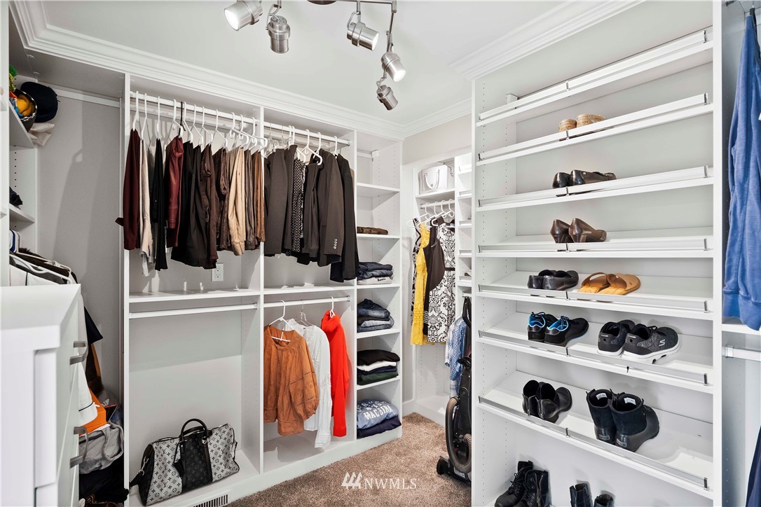 10404 Northeast 197th Street Bothell, WA 98011 - Photo 24 of 29 a view of walk in closet with clothes and shoes