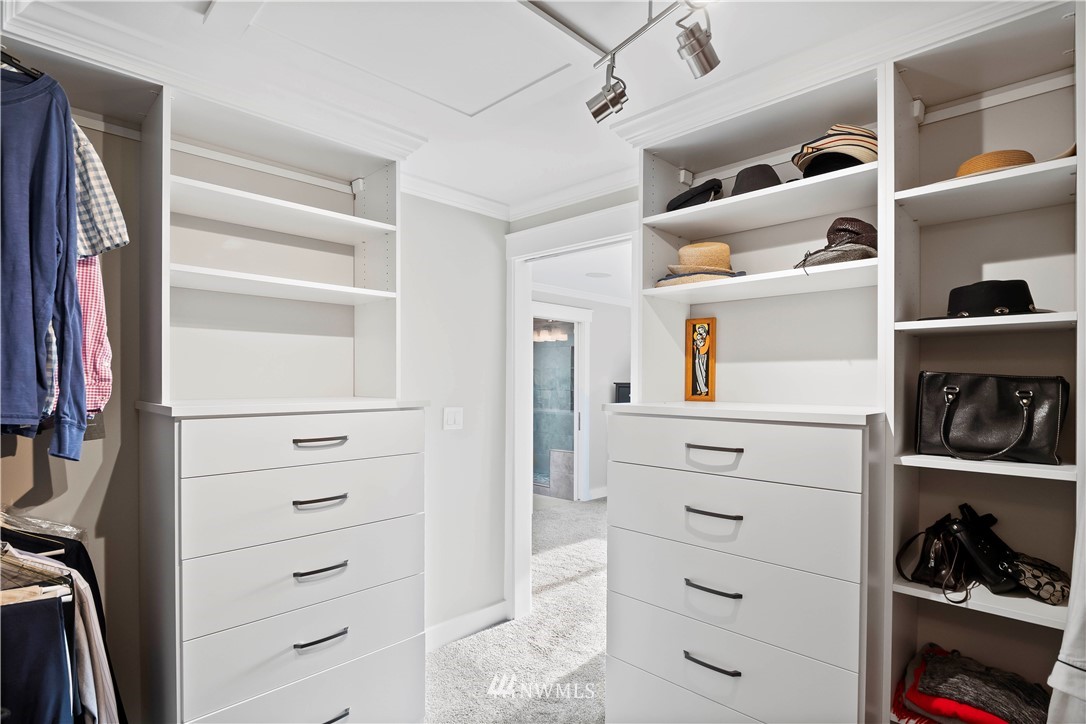 10404 Northeast 197th Street Bothell, WA 98011 - Photo 25 of 29 a view of walk in closet with clothes and shoes