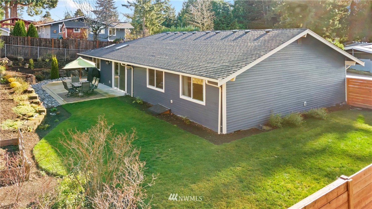 10404 Northeast 197th Street Bothell, WA 98011 - Photo 29 of 29 a aerial view of a house with swimming pool next to a yard
