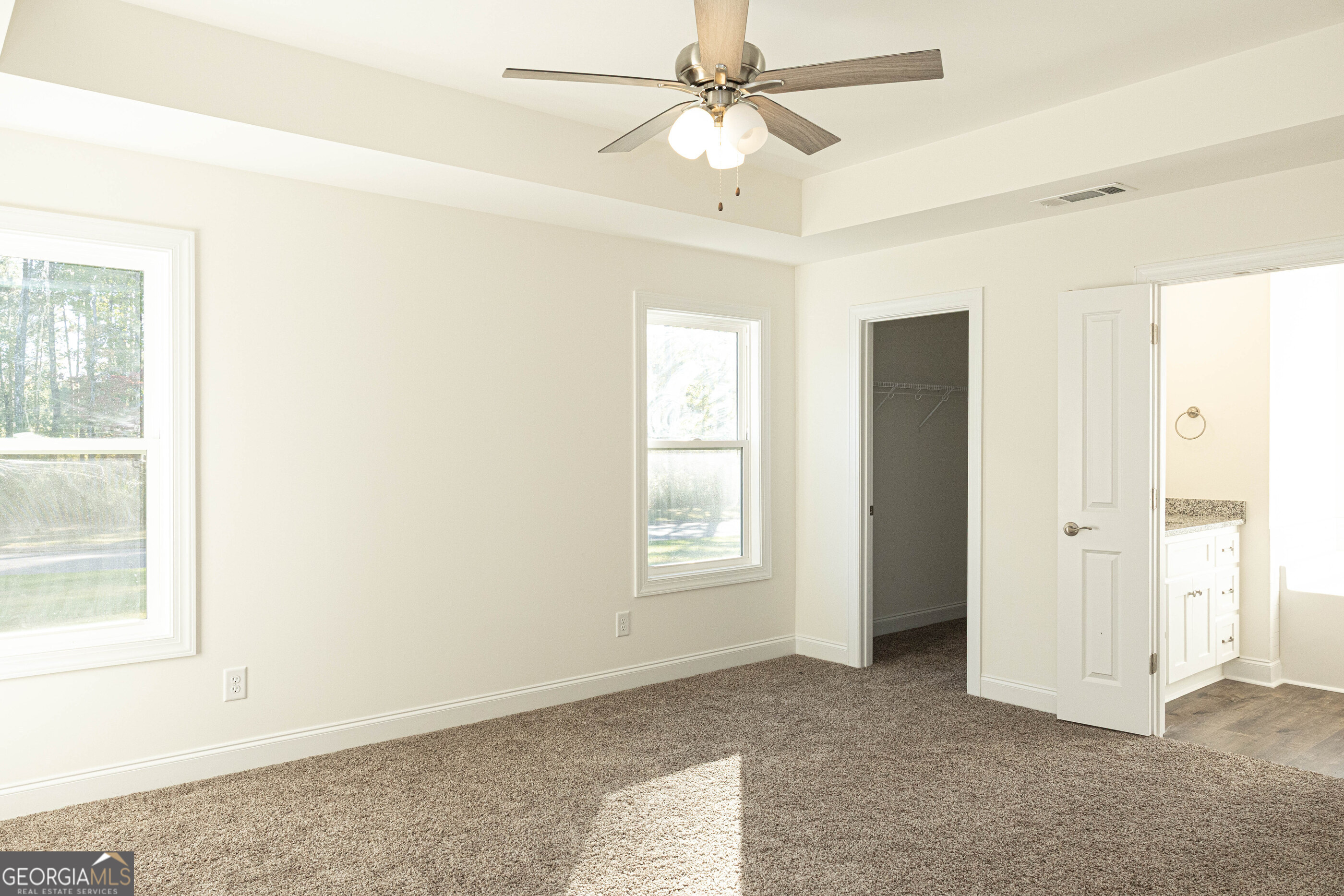 705 Riverside Estates Lanett, AL 36863 - Photo 11 of 29 an empty room with windows and fan