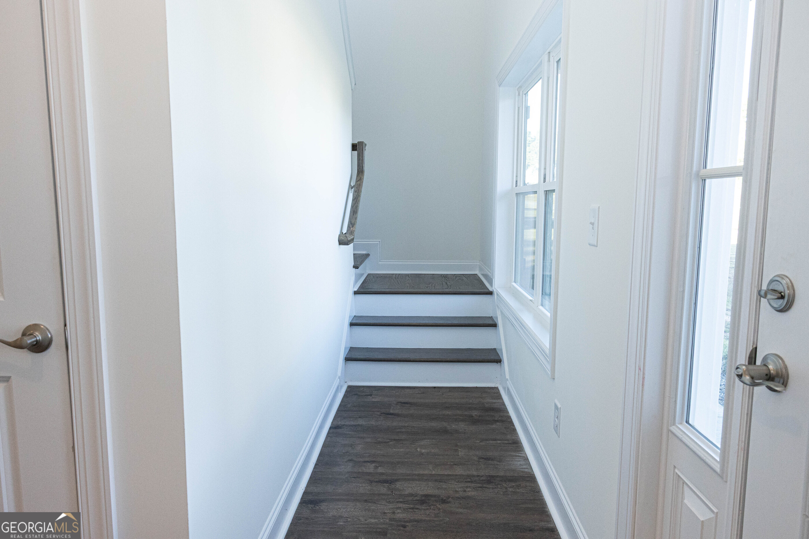 705 Riverside Estates Lanett, AL 36863 - Photo 16 of 29 a view of a hallway with a white walls and stairs