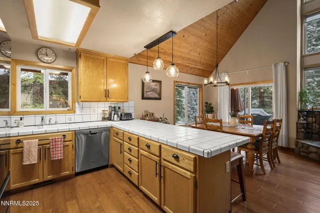 a view of a kitchen counter space and sink