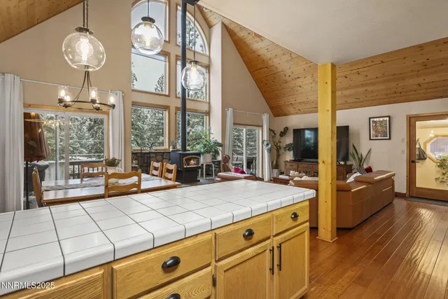 a living room with granite countertop furniture and a large window