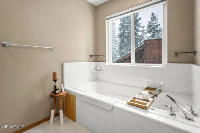 a bath tub sitting next to a window