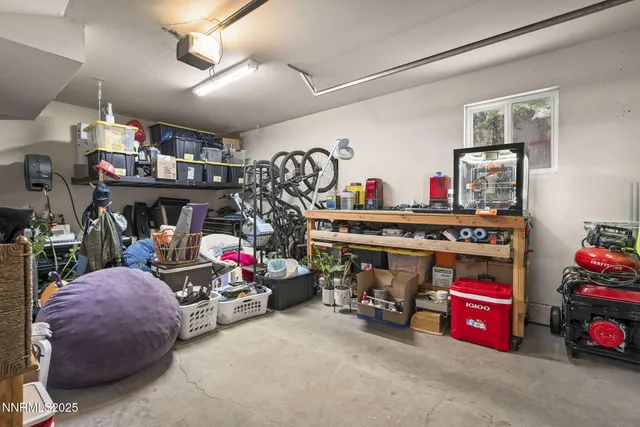 a utility room with lot of furniture and toys