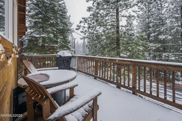 a view of balcony with furniture and trees