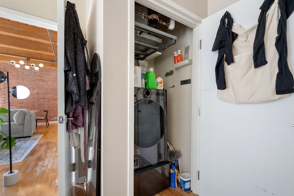 9 West Broadway, Unit 314 Boston, MA 02127 - Photo 20 of 25 a view of walk in closet with clothes and shoes