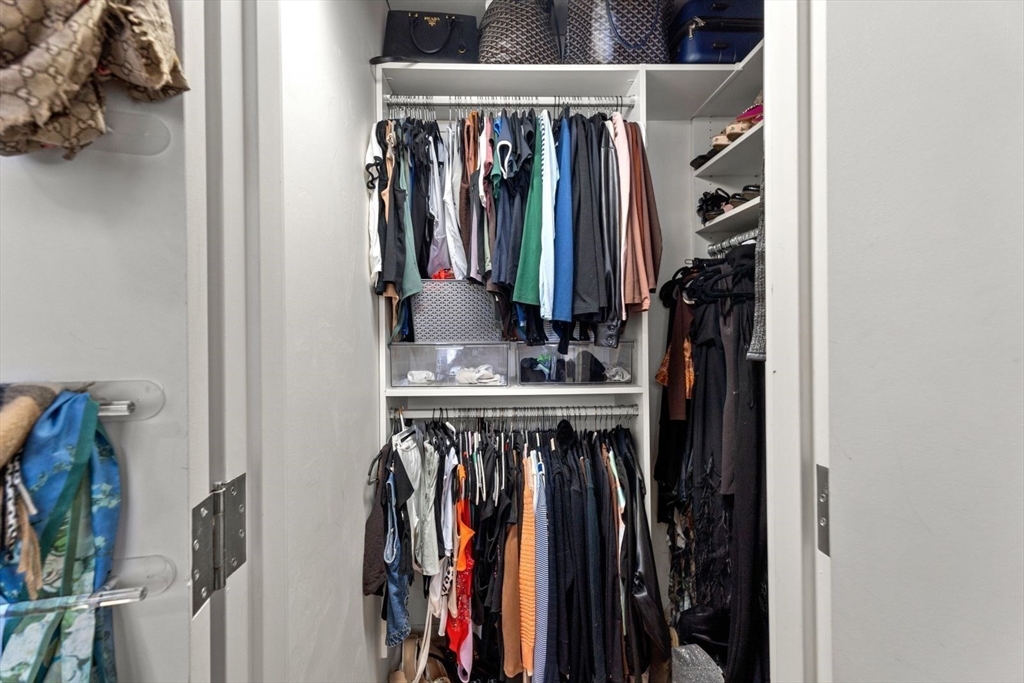 9 West Broadway, Unit 314 Boston, MA 02127 - Photo 23 of 25 a view of walk in closet with clothes