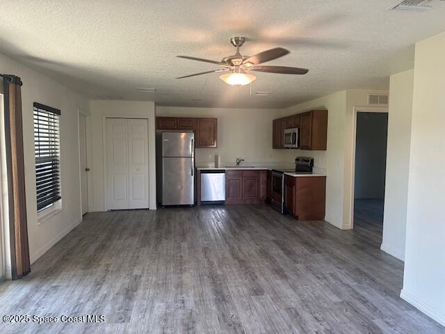 798 Lunar Lake Circle Cocoa, FL 32926 - Photo 2 of 10 a view of kitchen and empty room with wooden floor