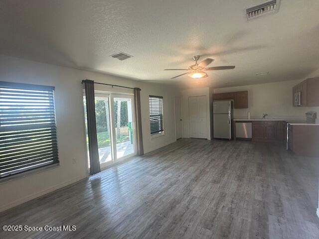 798 Lunar Lake Circle Cocoa, FL 32926 - Photo 3 of 10 wooden floor in an empty room with a window