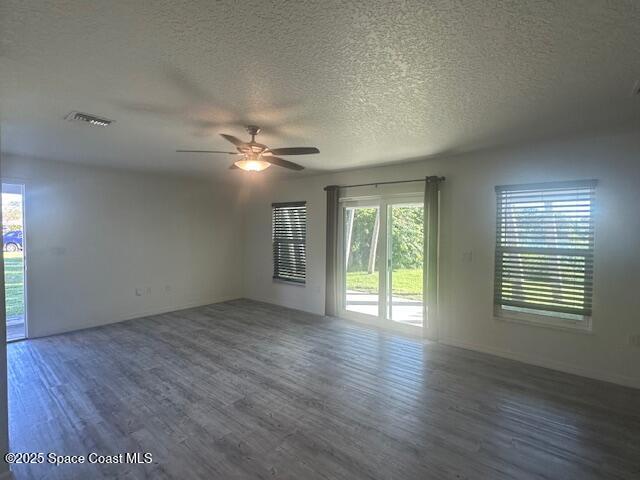798 Lunar Lake Circle Cocoa, FL 32926 - Photo 5 of 10 a view of an empty room with wooden floor and a window