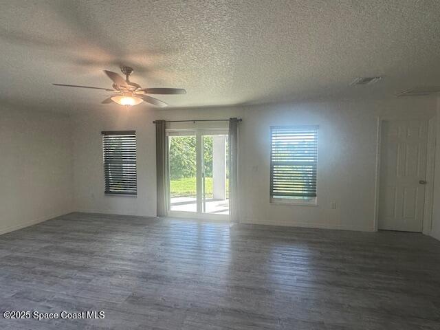 798 Lunar Lake Circle Cocoa, FL 32926 - Photo 6 of 10 an empty room with wooden floor and windows