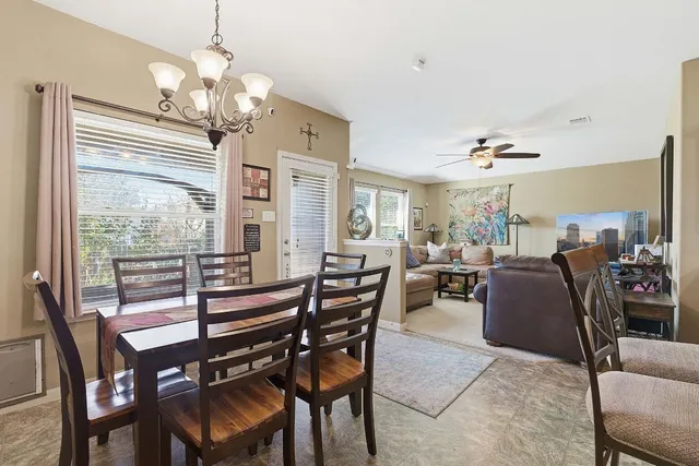 a kitchen with stainless steel appliances granite countertop a stove top oven microwave and cabinets