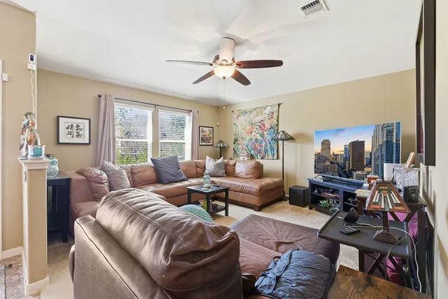 a living room with furniture and a window
