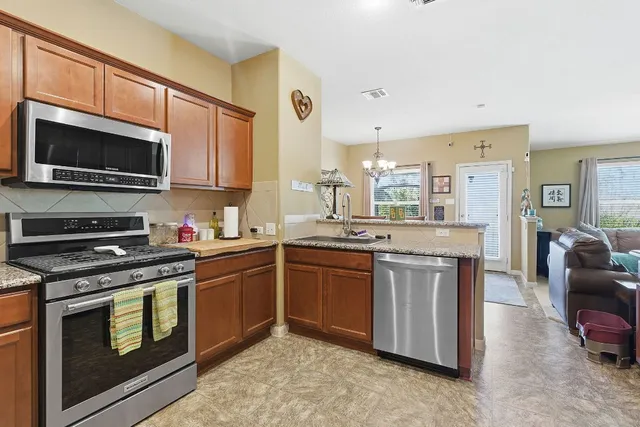 a view of a backyard with a tree