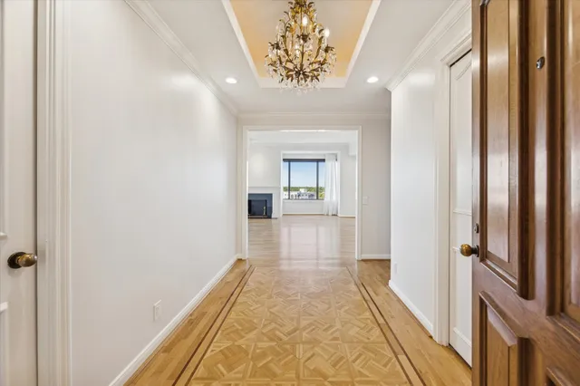 a view of a hallway with a chandelier