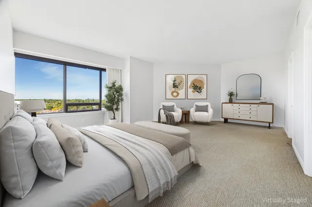 a bedroom with bed and window