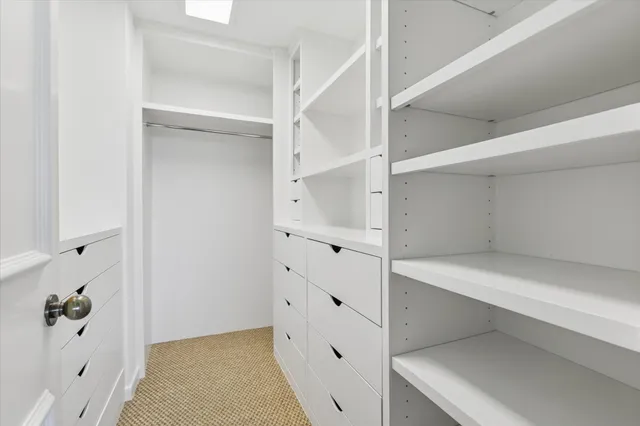 a view of an empty walk in closet
