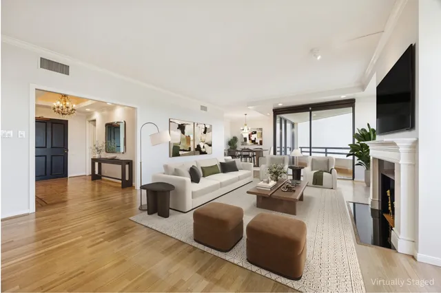 a living room with fireplace furniture and a flat screen tv