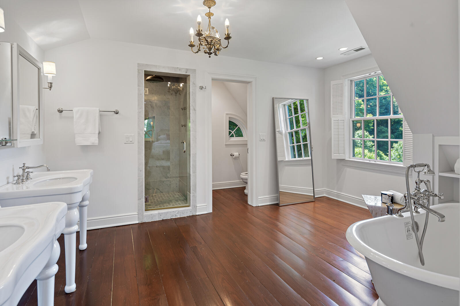 1446 Ponus Ridge Road New Canaan, CT 06840 - Photo 13 of 25 a spacious bathroom with a granite countertop sink a large mirror and a bathtub