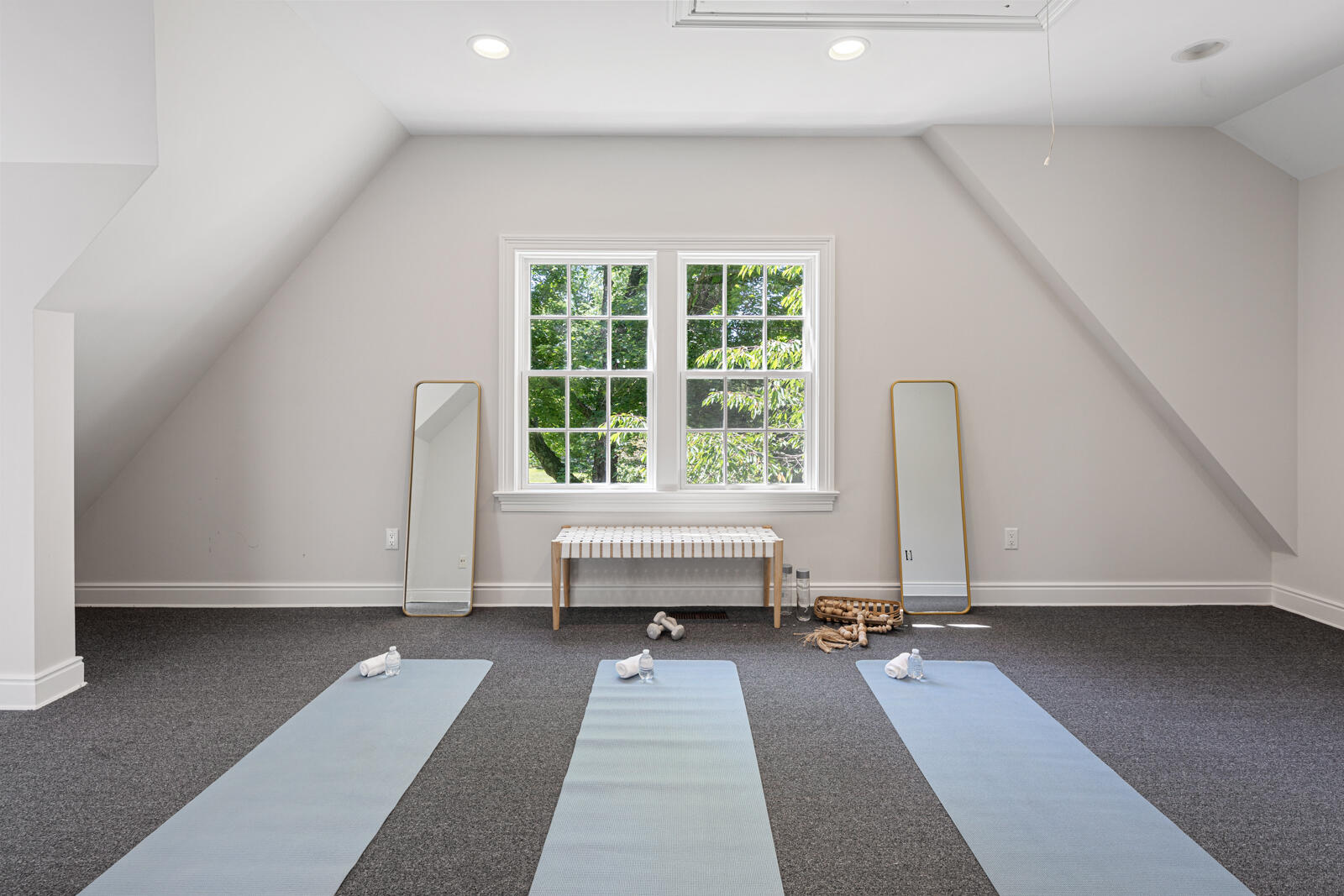 1446 Ponus Ridge Road New Canaan, CT 06840 - Photo 17 of 25 a view of a room with gym equipment and a large window