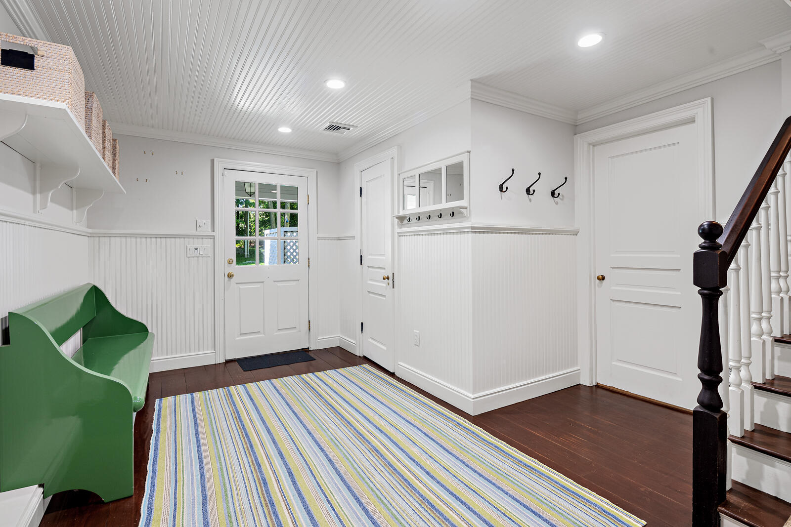 1446 Ponus Ridge Road New Canaan, CT 06840 - Photo 21 of 25 a view of a livingroom with wooden floor and stairs