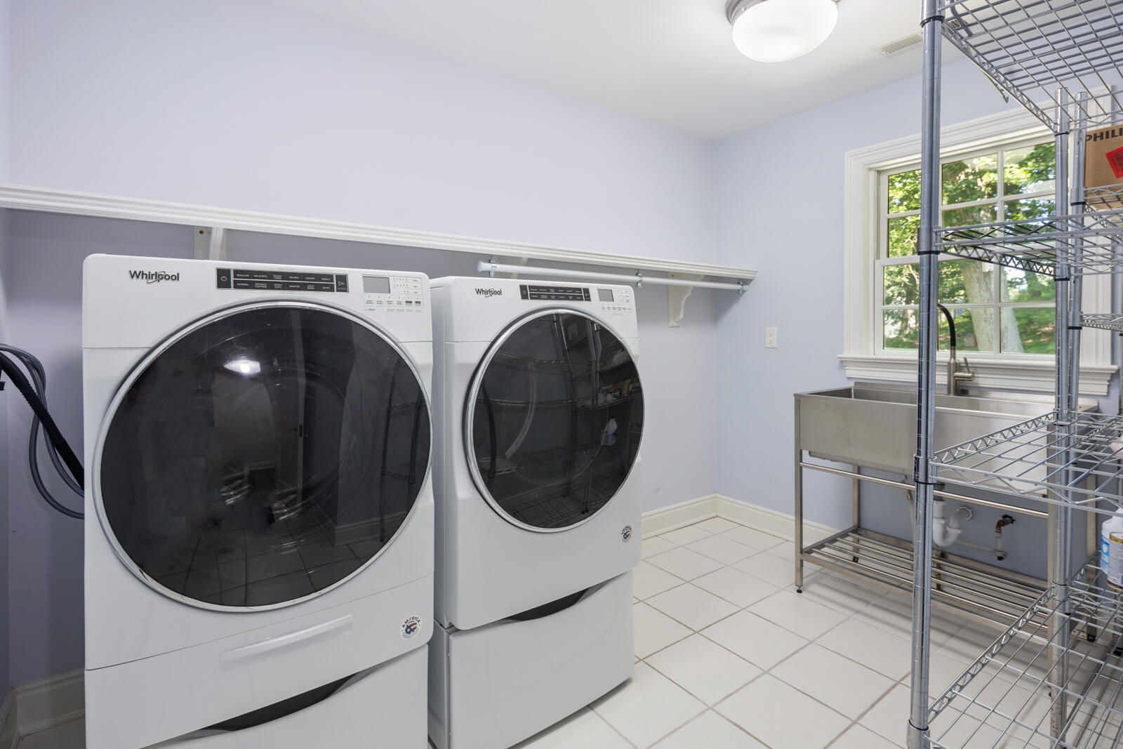 1446 Ponus Ridge Road New Canaan, CT 06840 - Photo 22 of 25 a utility room with dryer and washer